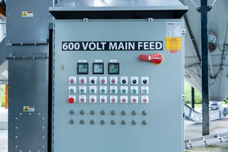 Push-button grain handling control panel with labeled switches